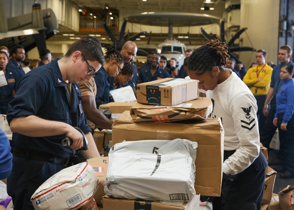 Abraham Lincoln Sailors process cargo