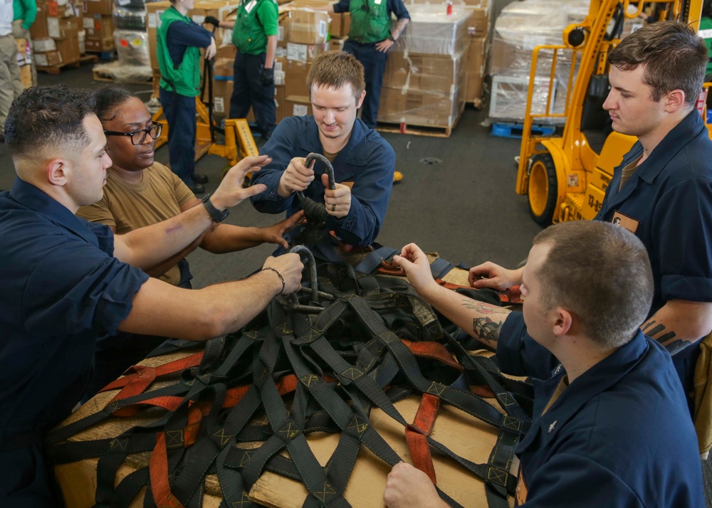 Abraham Lincoln Sailors secure cargo