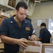 Abraham Lincoln Sailors sort cargo