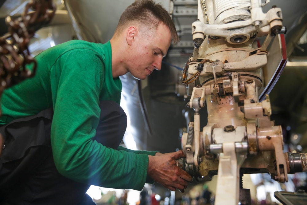 Abraham Lincoln Sailors conduct aircraft maintenance