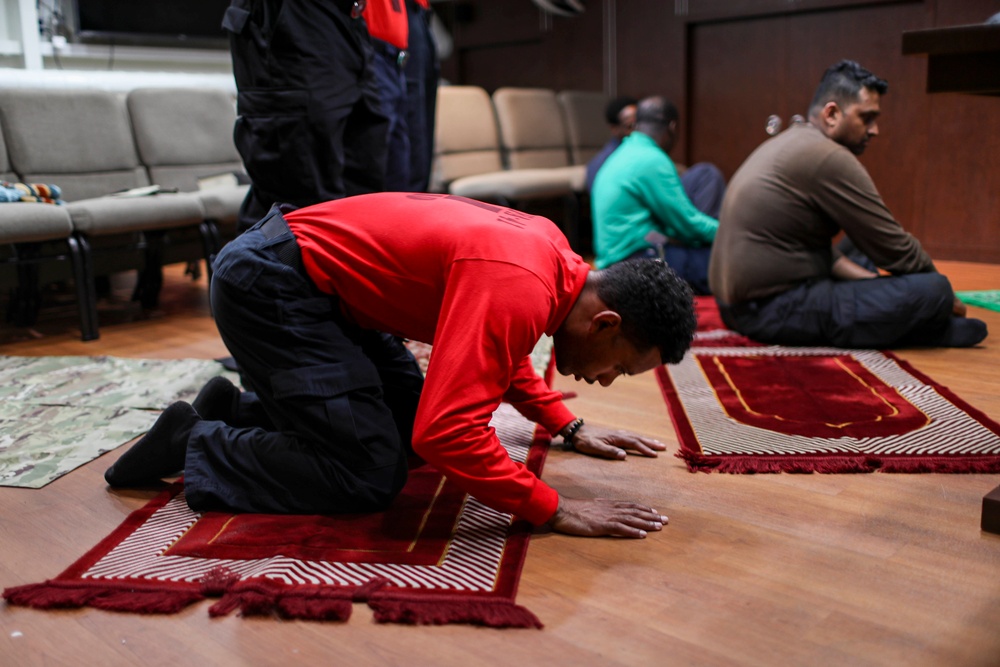Abraham Lincoln Sailors practice Muslim prayer