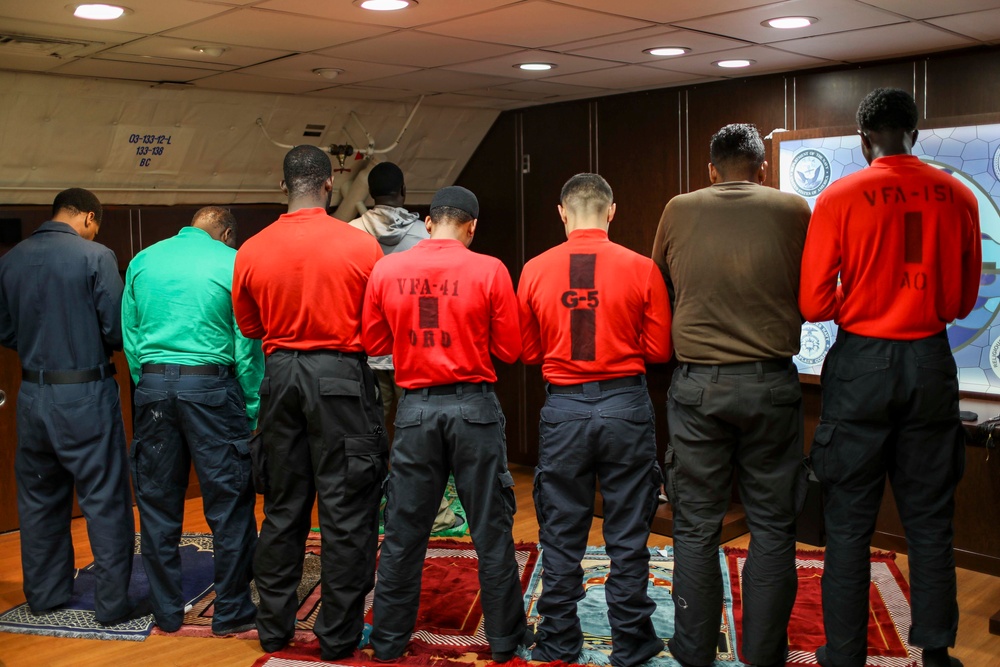 Abraham Lincoln Sailors practice Muslim prayer