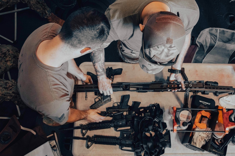 Coast Guardsmen Aboard USS Billings Cleans Weapons