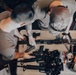 Coast Guardsmen Aboard USS Billings Cleans Weapons