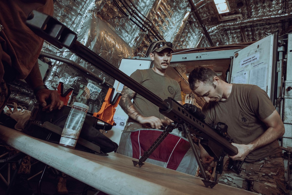 Coast Guardsmen Aboard USS Billings Cleans Weapons