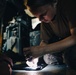 HSC 28 Sailors Install Equipment to Sea Hawk Helicopter