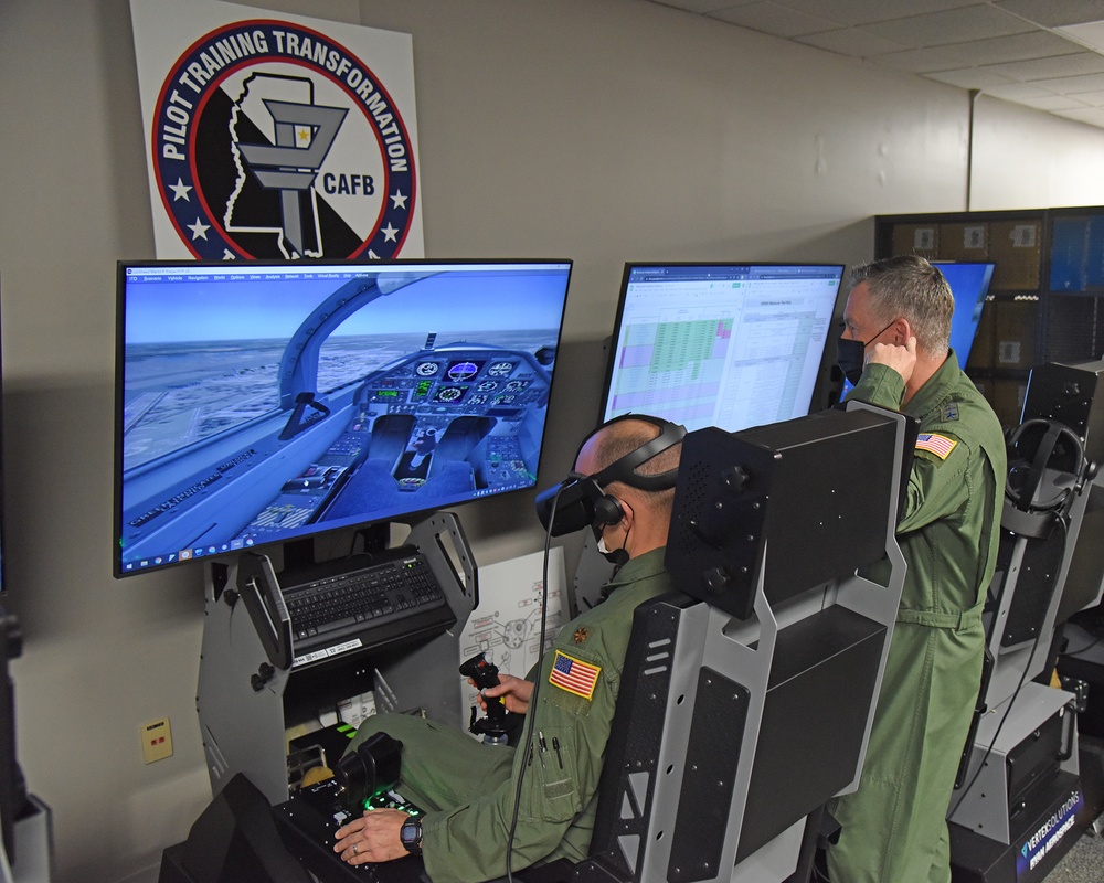Lt Gen Webb (AETC/CC) receiving an Immersive Training Device (ITD / T6 Flight Simulator) demonstration from Maj Chris Yost.