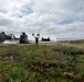 Sailor assigned to Beach Master Unit One guides a LCAC onto the beach