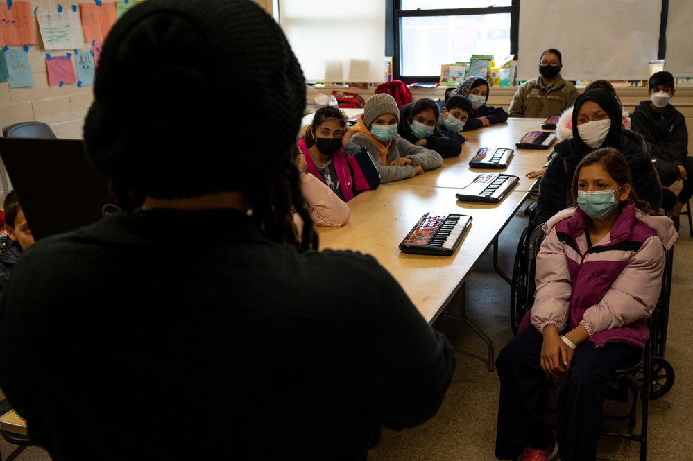 Music lessons at Task Force Liberty