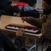 Music lessons at Task Force Liberty