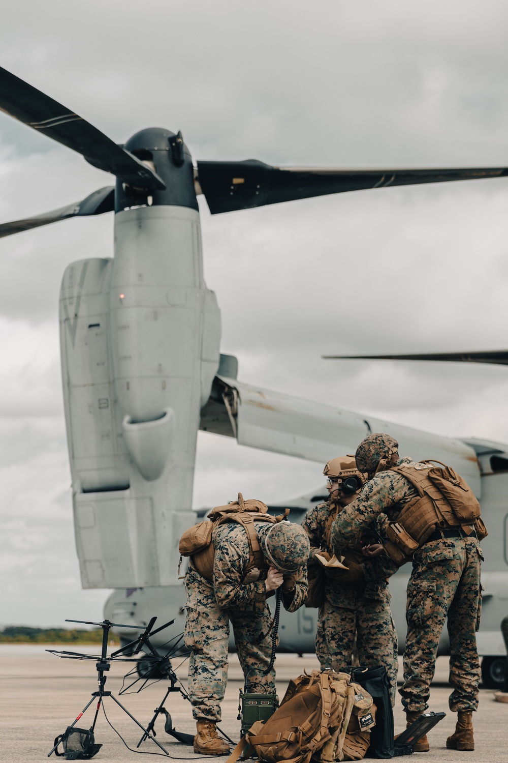 U.S. Marines work with the U.S. Navy on refueling a P-8A Poseidon during Noble Fusion