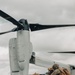 U.S. Marines work with the U.S. Navy on refueling a P-8A Poseidon during Noble Fusion