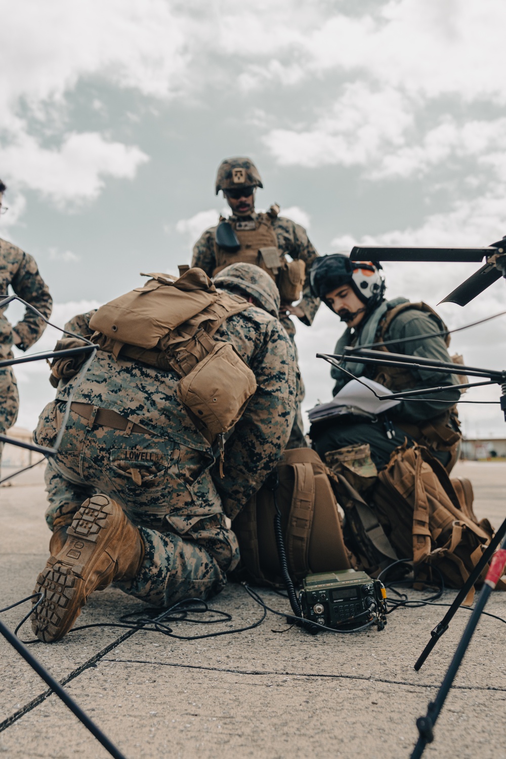 U.S. Marines work with the U.S. Navy on refueling a P-8A Poseidon during Noble Fusion