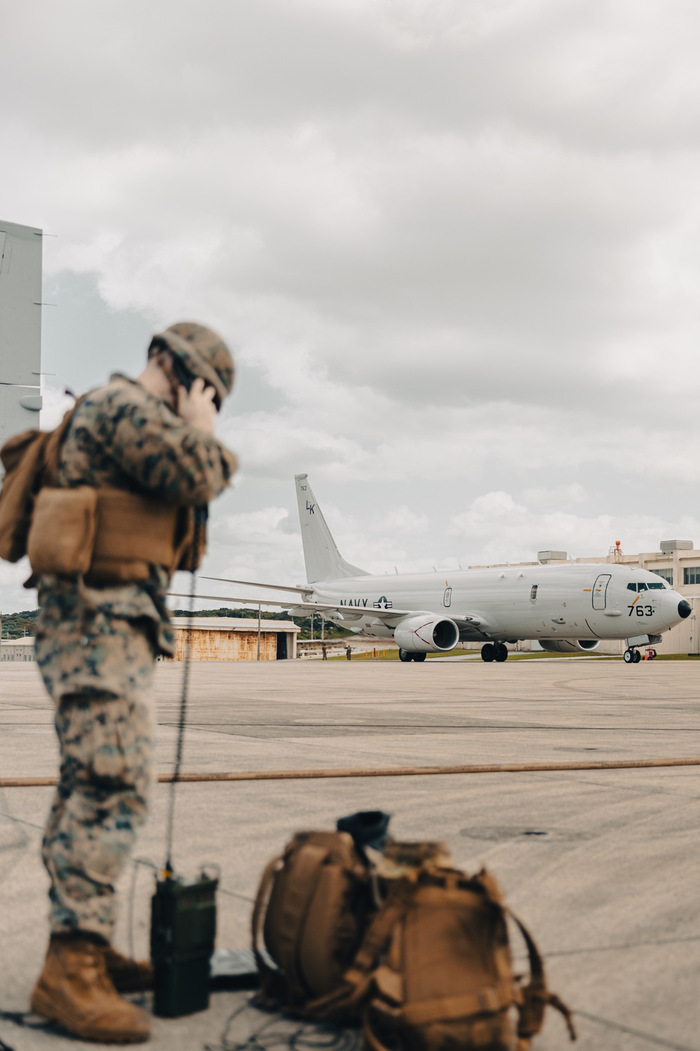 U.S. Marines work with the U.S. Navy on refueling a P-8A Poseidon during Noble Fusion