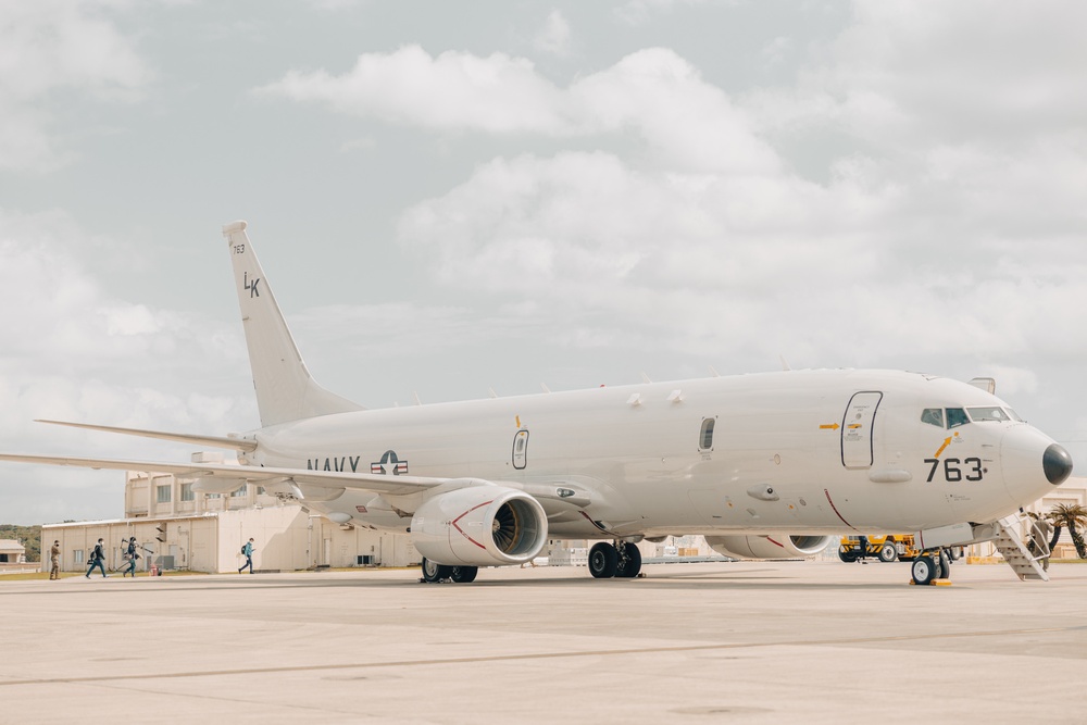 U.S. Marines work with the U.S. Navy on refueling a P-8A Poseidon during Noble Fusion