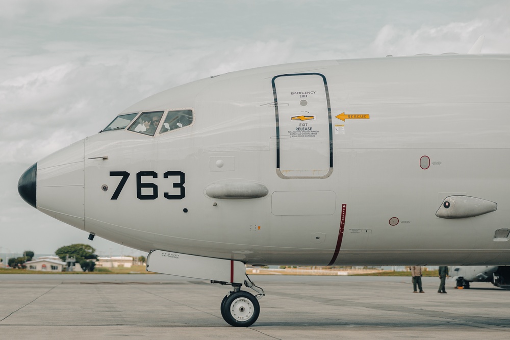 U.S. Marines work with the U.S. Navy on refueling a P-8A Poseidon during Noble Fusion