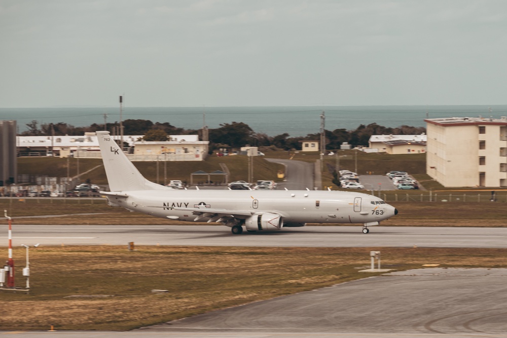 U.S. Marines work with the U.S. Navy on refueling a P-8A Poseidon during Noble Fusion