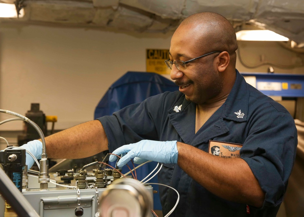 Abraham Lincoln Sailors conduct aircraft maintenance