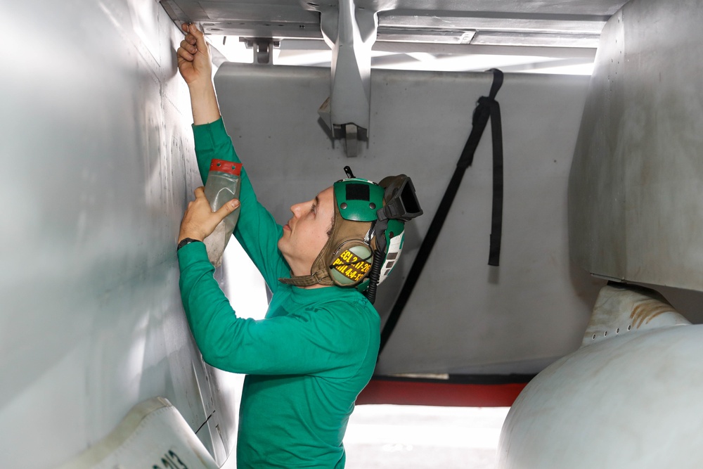 Abraham Lincoln Sailors conduct aircraft maintenance