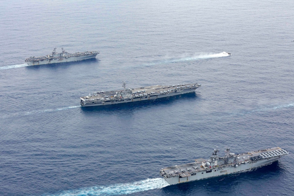 Abraham Lincoln sails in formation during exercise Noble Fusion