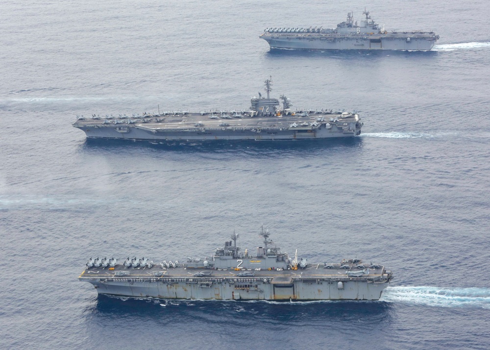 Abraham Lincoln sails in formation during exercise Noble Fusion