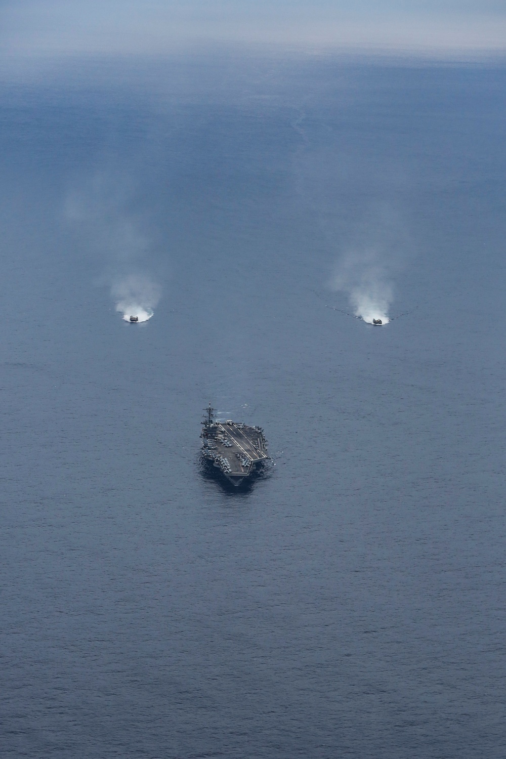Abraham Lincoln sails in formation during exercise Noble Fusion