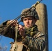 Marine engineers and Navy Seabees construct a one rope bridge during Winter Pioneer 22