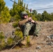 Marine engineers and Navy Seabees construct a one rope bridge during Winter Pioneer 22