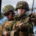 Marine engineers and Navy Seabees construct a one rope bridge during Winter Pioneer 22