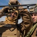 Marine engineers and Navy Seabees construct a one rope bridge during Winter Pioneer 22