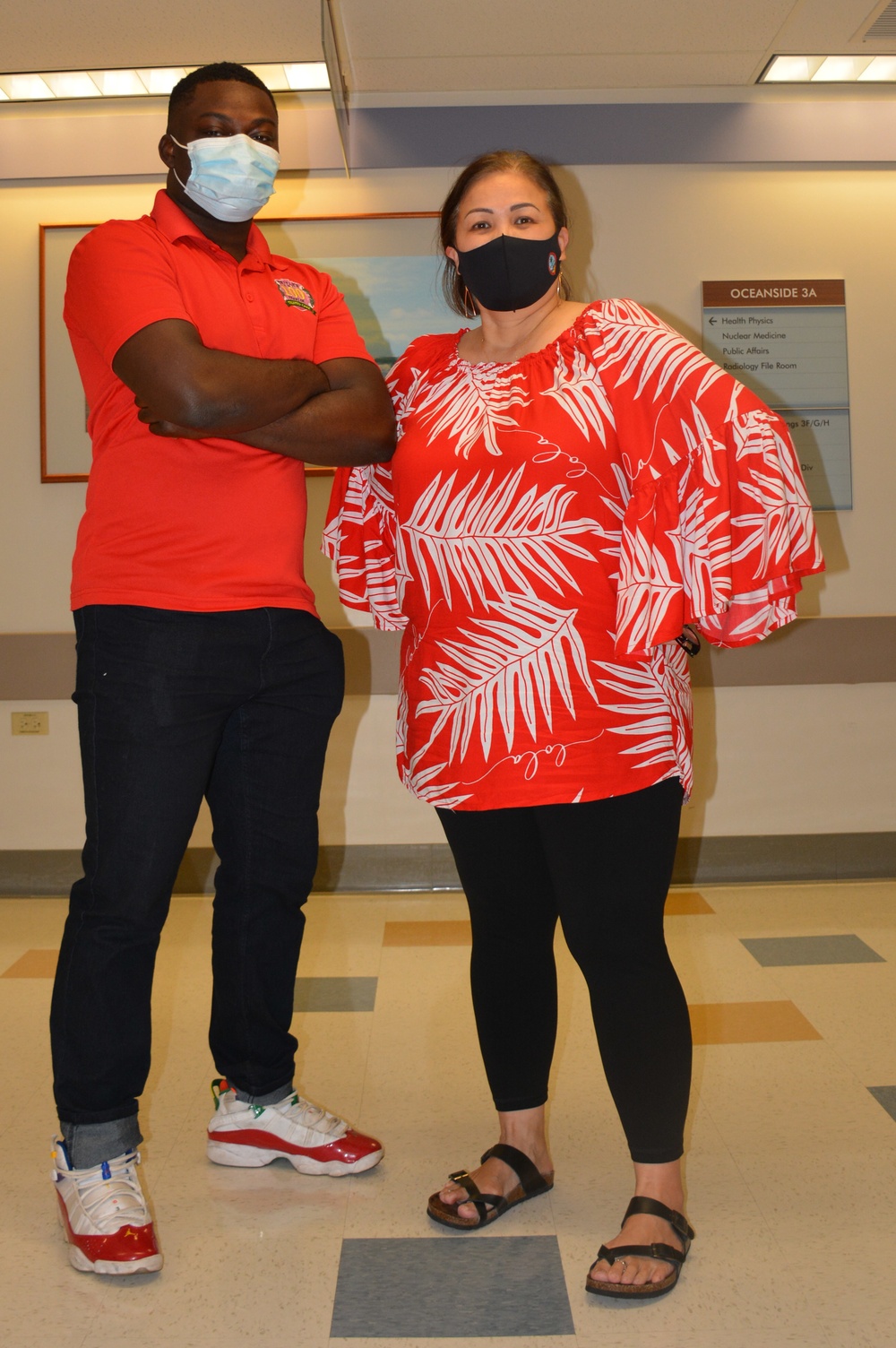 Spc. Jamarree Daniels and Ms. Marivic Catimon celebrate National Wear Red Day