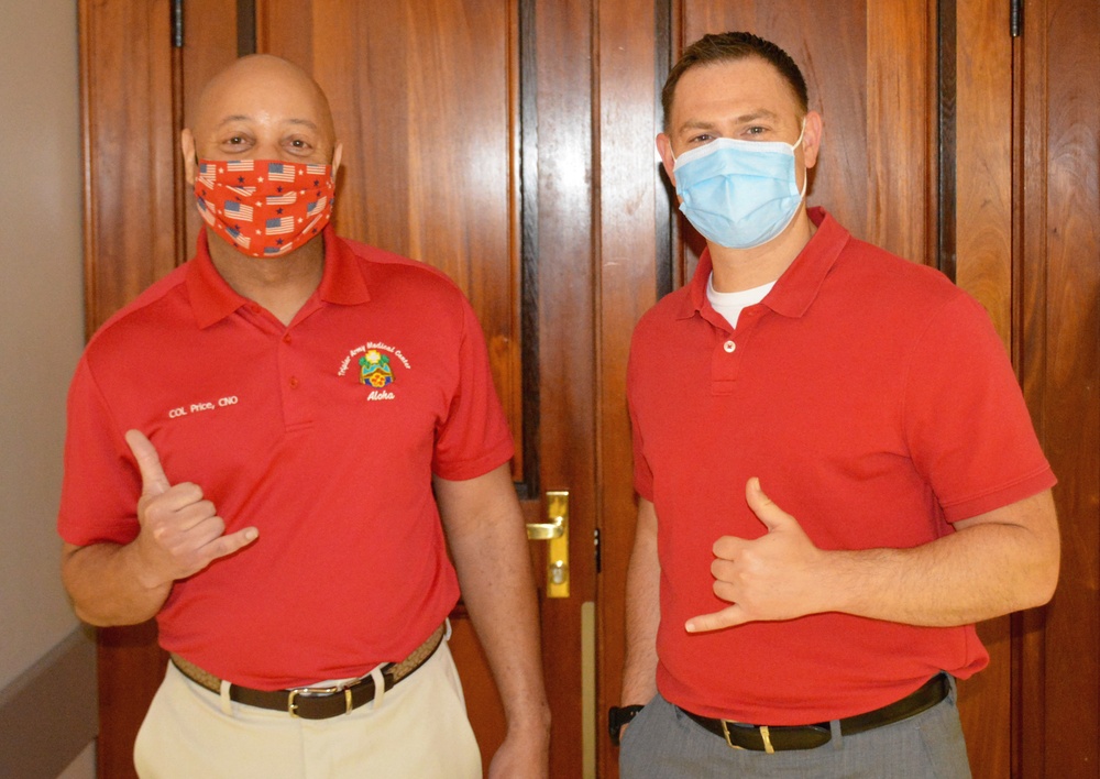 Col. Prentice Prince and Maj. Jason Robinson celebrate National Wear Red Day