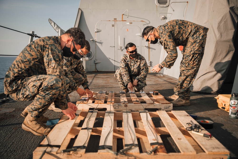 EOD Marines conduct time fuse burn aboard USS Portland (LPD 27)