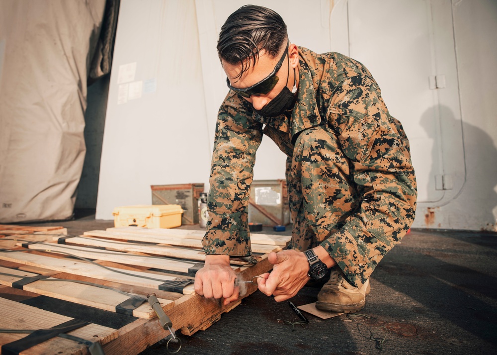 EOD Marines conduct time fuse burn aboard USS Portland (LPD 27)