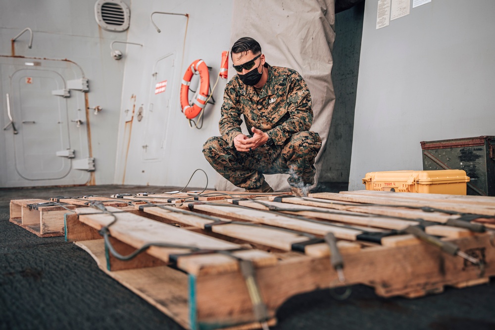 EOD Marines conduct time fuse burn aboard USS Portland (LPD 27)