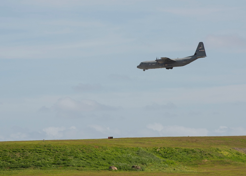 Aircraft flies over Andersen AFB during Cope North 22