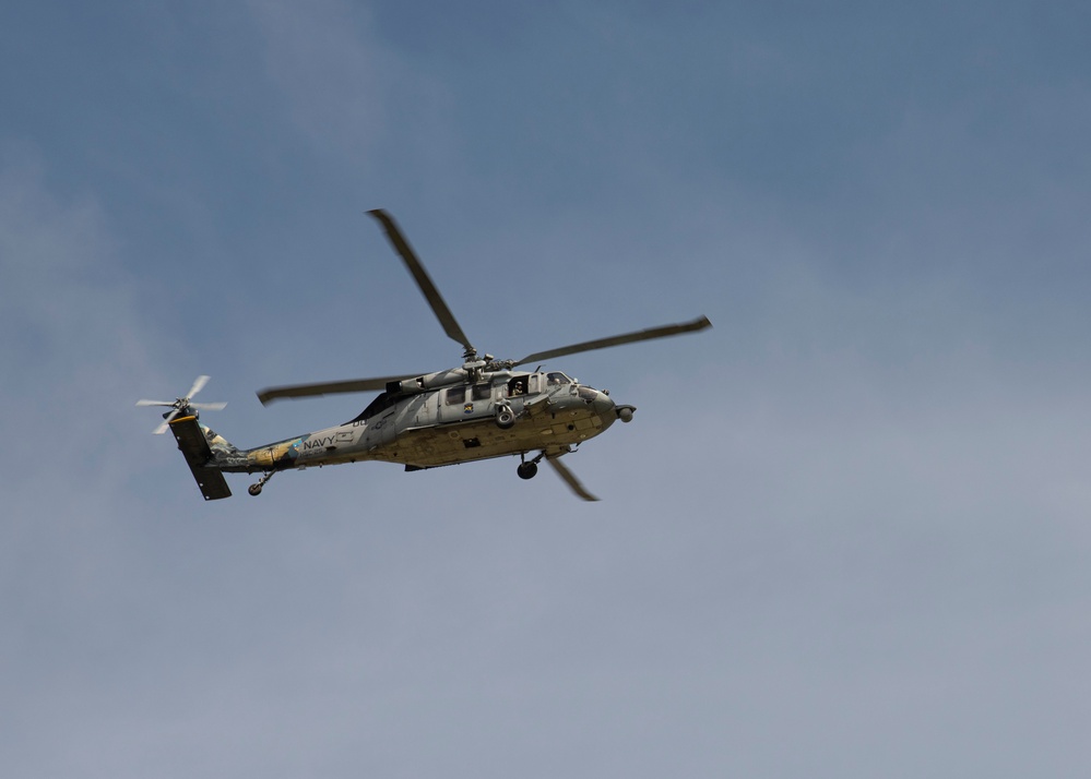 Aircraft flies over Andersen AFB during Cope North 22