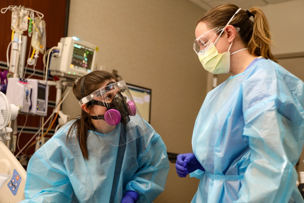 U.S. Air Force nurse and INTEGRIS Health nurse provide care to a patient