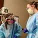 U.S. Air Force nurse and INTEGRIS Health nurse provide care to a patient
