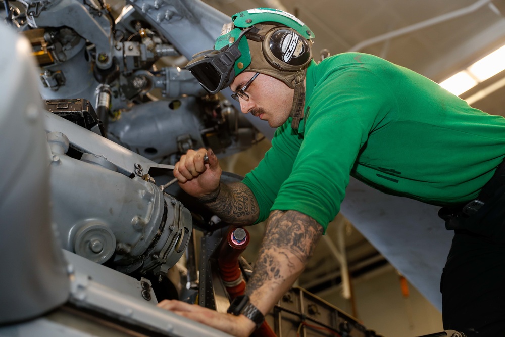 Abraham Lincoln Sailors conduct aircraft maintenance