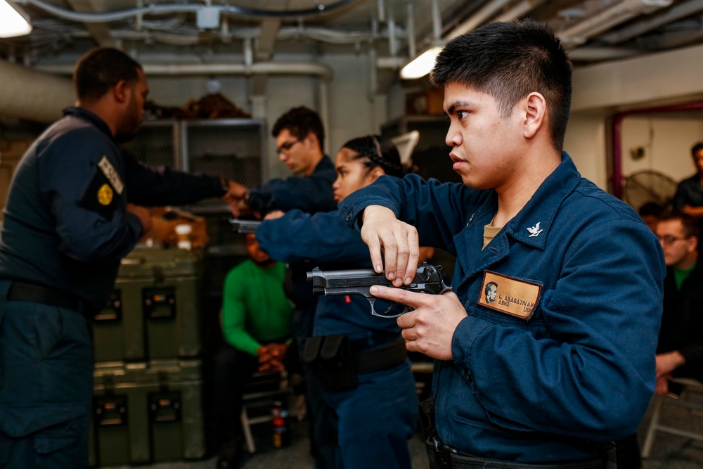 Abraham Lincoln Sailors practice weapon skills