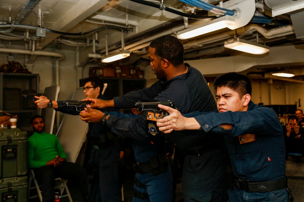 Abraham Lincoln Sailors practice weapon skills