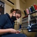 Sailor Cuts Loose Strings Off Name Tag