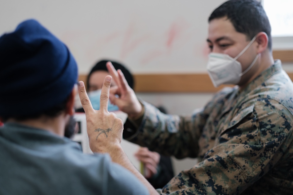 TF McCoy Marine Teaches Sign Language to Deaf Afghan Child