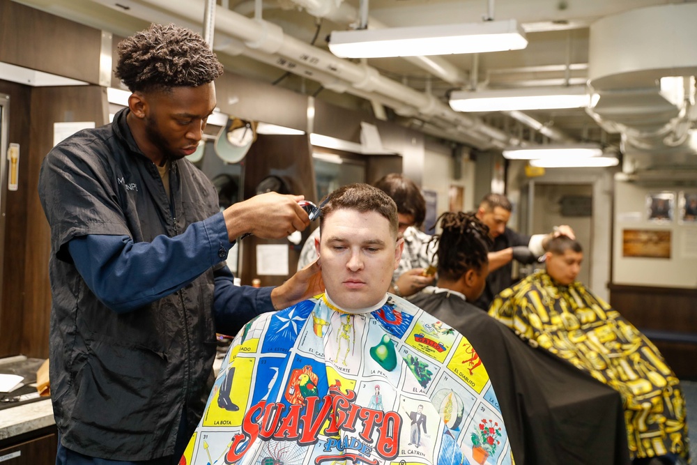 Abraham Lincoln Sailors get haircuts