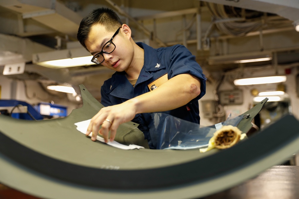 Abraham Lincoln Sailors conduct aircraft maintenance