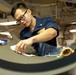 Abraham Lincoln Sailors conduct aircraft maintenance