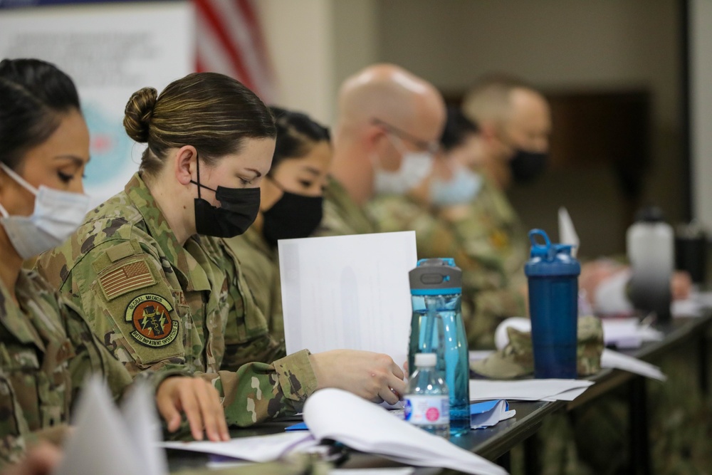 U.S  Air Force Military Medical Team Receive a Joint Reception, Staging, Onward Movement and Integration Brief at Lawrence General Hospital