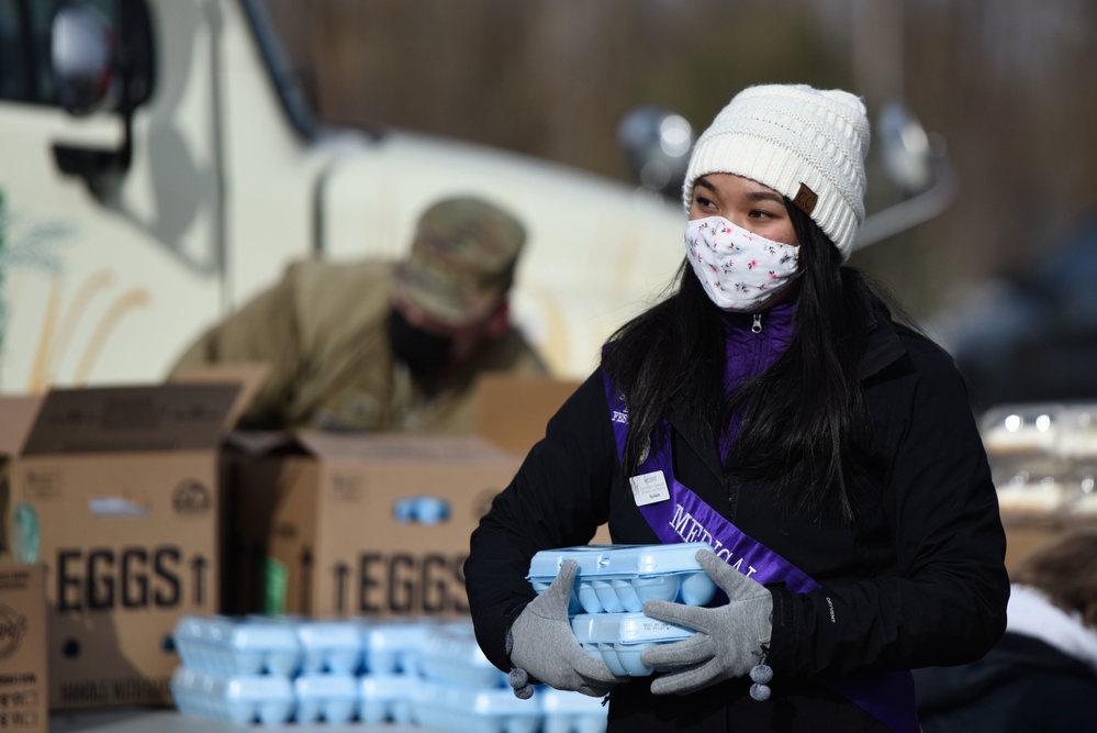 Lilac Festival Princesses' help Team Fairchild during the Harvest Food Distribution