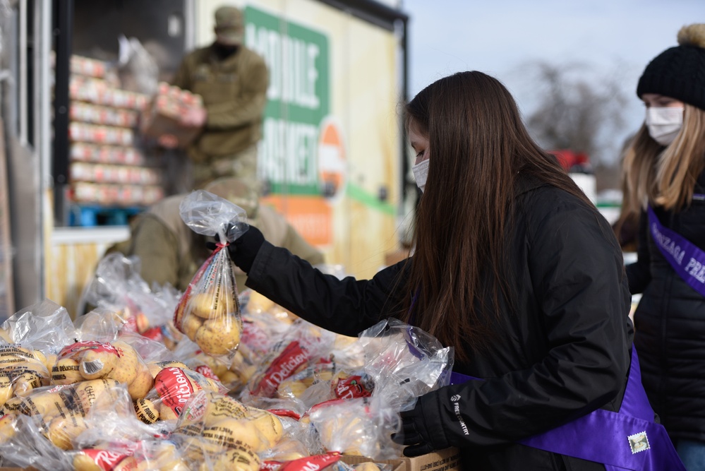 Lilac Festival Princesses' help Team Fairchild during the Harvest Food Distribution